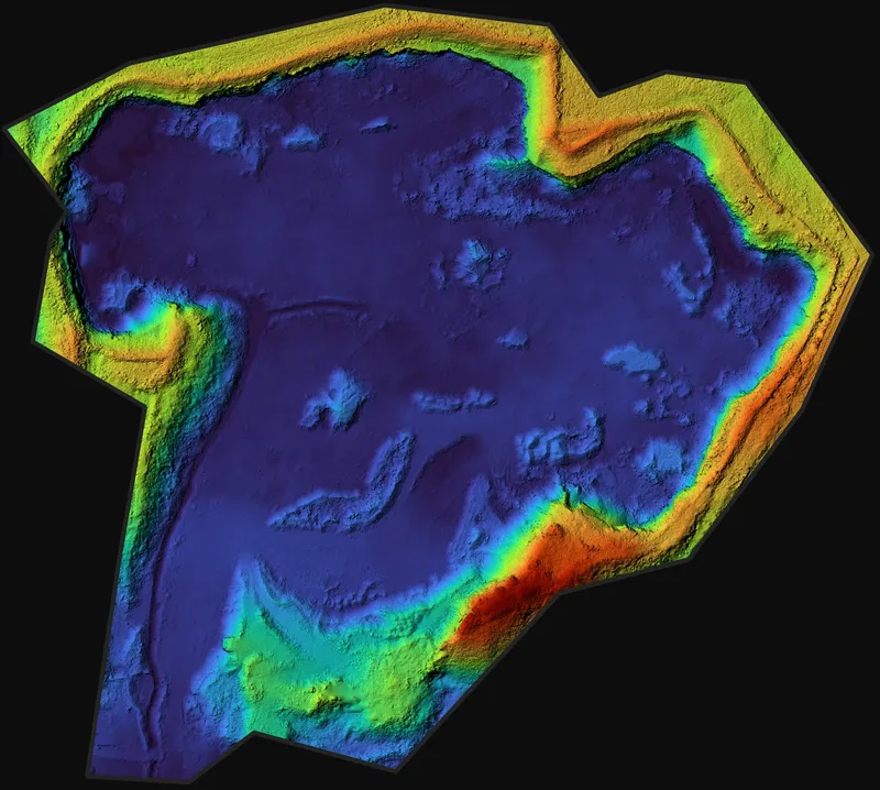 Terrain model of a quarry, coloured by height from a deep blue floor to red high ground.